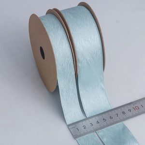 40mm light blue herringbone ribbon with textured jacquard finish on a kraft paper roll