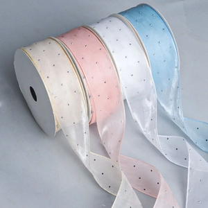 Detail of macaron chiffon ribbons with silver glitter dots for DIY floral gift decor