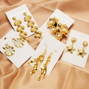 Gold plated stainless steel earring set with pearls and rhinestones on silk