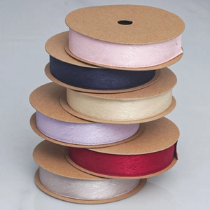 Macro detail of six multi-color herringbone twill ribbons for DIY gift packaging