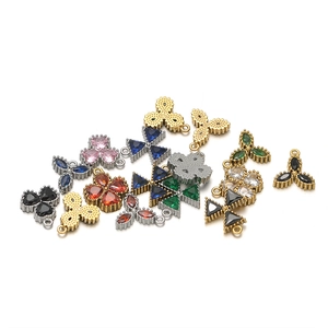 Detailed collection of gold and silver plated clover jewelry charms with colorful gemstones