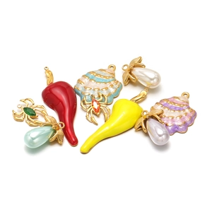 Assorted stainless steel DIY pendants featuring chili, shells, and jeweled spiders