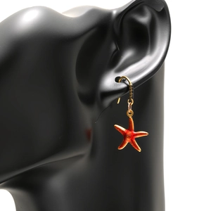 Starfish drop earrings in orange-red with gold-plated hooks and black stone accents