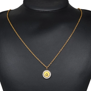 Gold Libra zodiac pendant necklace with sparkling crystals on black jewelry bust stand