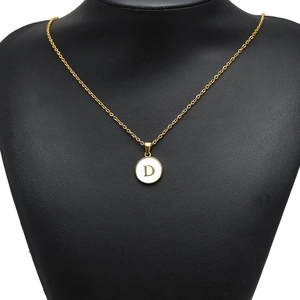 Golden stainless steel necklace with white enamel round letter D pendant on neck model