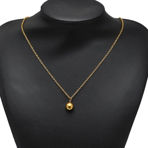 Polished gold stainless steel sphere pendant on a delicate chain necklace