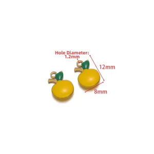 Yellow apple pendant in stainless steel with green leaf and 12mm x 8mm dimensions