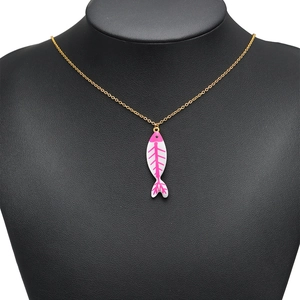 Golden necklace featuring a vibrant pink and white enamel fishbone pendant on a black bust