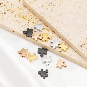Puzzle-shaped stainless steel beads in gold, silver, rose gold and black for DIY jewelry