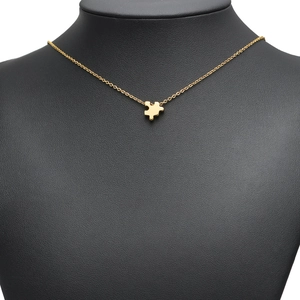Minimalist gold-plated stainless steel puzzle piece pendant necklace on model bust