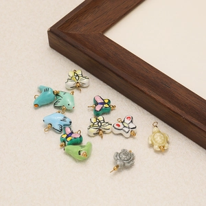 Handcrafted ceramic charms set featuring bird and butterfly shapes for DIY jewelry making