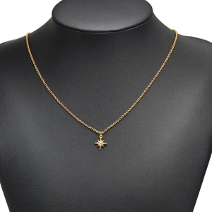 Polished stainless steel star pendant necklace with zircon stone on display stand