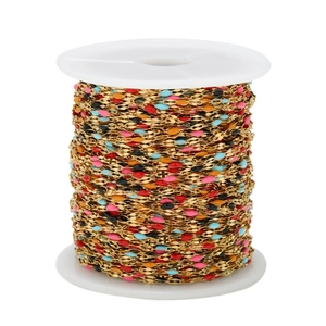 Macro shot of colorful enamel dots on gold-plated stainless steel DIY jewelry chain