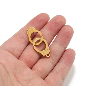 Golden freedom handcuff charm pendants for DIY jewelry making on hand palm