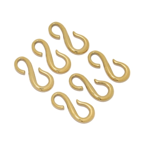 Close-up of six gold-plated S-shape jewelry connectors for DIY necklace making