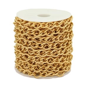Golden stainless steel twisted curb chain on a white spool for DIY jewelry making