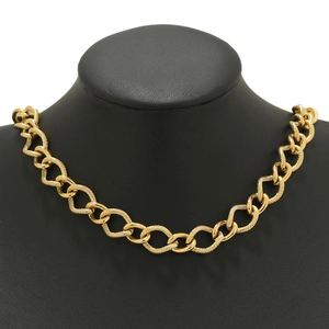Industrial gold chunky chain necklace with textured oval links on a neck display