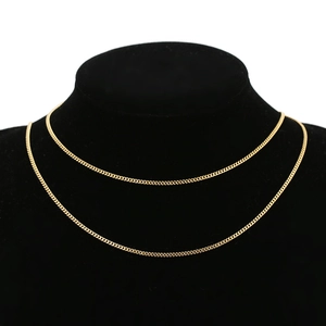 1.8mm 18k gold plated stainless steel curb chain necklace displayed on a black neck model