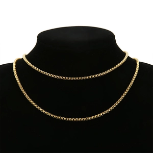 Detailed close-up of a 3mm 18k gold-plated stainless steel box chain on a black display