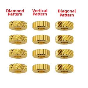 Detailed view of 6mm gold stainless steel beads with grid, vertical and diagonal textures