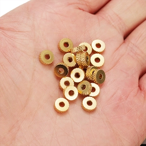 6mm gold-plated stainless steel wheel beads with textured knurling for DIY jewelry