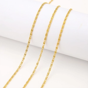 Macro view of 2mm 18K gold-plated stainless steel S-link chain on white display stand