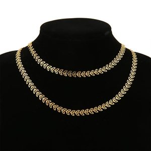 6mm gold hollow leaf chain stainless steel necklace displayed on a black neck mannequin