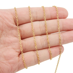 Macro view of ultra-thin 18k gold-plated stainless steel oval link chain on hand