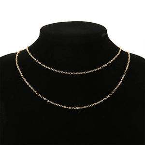 Detail view of 18k gold plated stainless steel O-chain necklaces on a black neck display