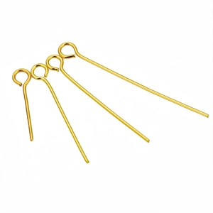 Macro shot of gold-plated stainless steel eye pins in various lengths for DIY jewelry making
