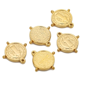 Detailed macro view of 18k gold vintage religious cross pendants with four-hole connectors