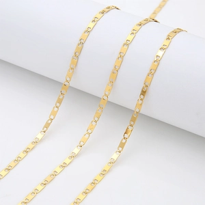 Close-up of 2.7mm 18k gold-plated stainless steel chain wrapped on a white cylinder