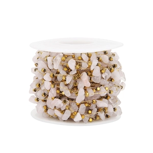 Detail of DIY natural pink crystal gravel and gold square beads on a stainless steel chain