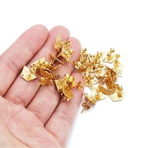Macro view of 18k gold plated stainless steel DIY earring charms with hammered texture