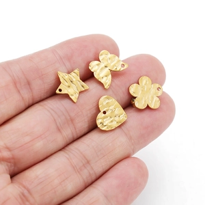 Golden textured geometric earring pendants in star, butterfly, heart and flower shapes