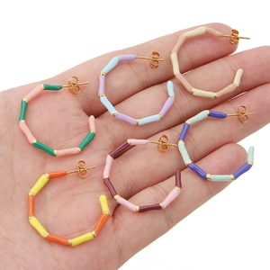 Bamboo style C-shaped acrylic enamel earrings in vibrant mixed colors and gold finish
