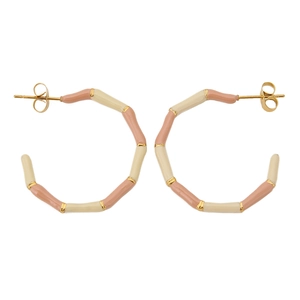 Detailed close-up of C-shaped bamboo texture earrings with cream and pink enamel finish