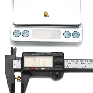 Detailed measurement of 18K gold-plated silicone stopper bead on digital scale