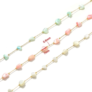 Detail view of 0.8mm gold chain with 7mm colorful natural shell beads for DIY jewelry