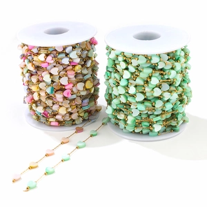 Detail view of 6mm heart shell beads on gold chain for DIY jewelry making and crafting