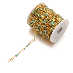 Close-up of 18k gold-plated chain with blue and yellow oil-dripped daisy charms
