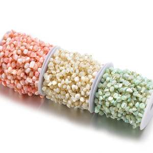 Detail view of 7mm colorful shell bead chains on rolls for DIY jewelry making