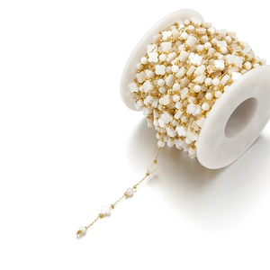 Detailed view of 8mm shell clover and round beads on 18k gold-plated stainless steel chain