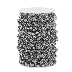 Polished stainless steel ball and link jewelry chain wound on a white spool for DIY