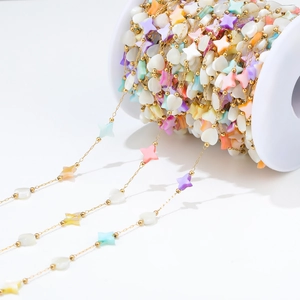 Colorful heart and star bead chain on a spool for DIY jewelry making and necklace crafts