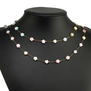 Gold-plated stainless steel necklace with multi-color floral charms on black neck bust