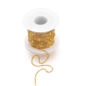 18K gold plated stainless steel embossed curb chain on a white plastic spool