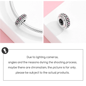 Detailed macro view of S925 sterling silver bead charm with red zircons on snake chain