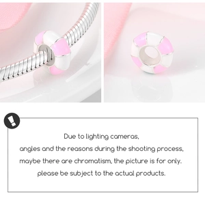 Detailed macro view of pink and white striped S925 silver donut charm on snake chain