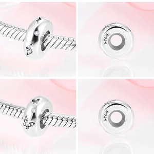 Detailed macro view of S925 sterling silver butterfly charm with cubic zirconia inlay